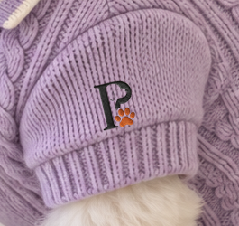 Close view of the lavender polo left sleeve monogram